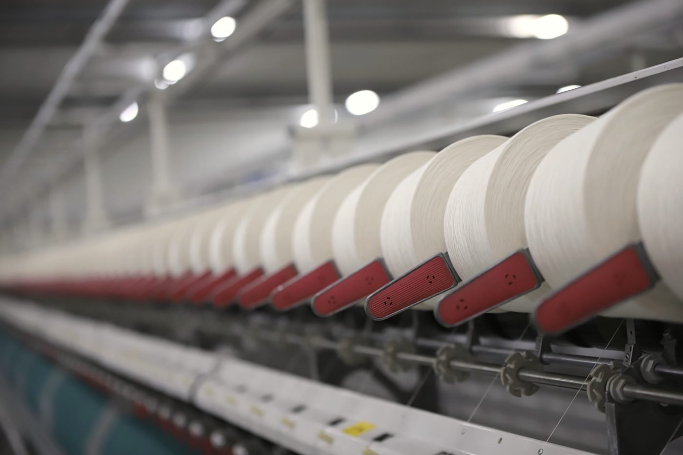 A long run of lint handling machinery inside a plant.